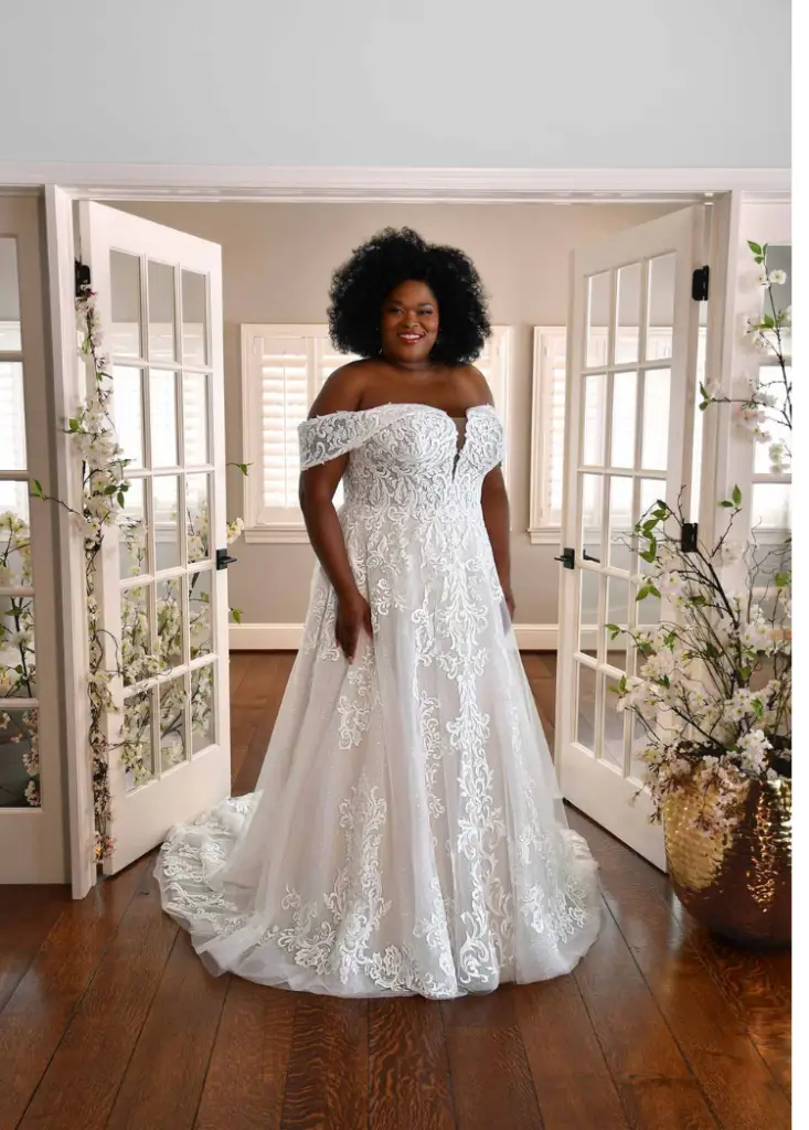 bride wearing off the shoulder lace plus size wedding dress