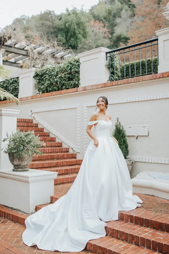 bride wearing minimalist wedding dress on grand staircase