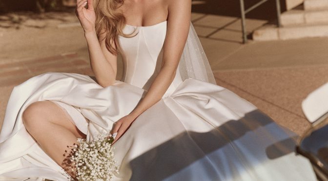 Beautiful bride wearing ballgown and sunglasses