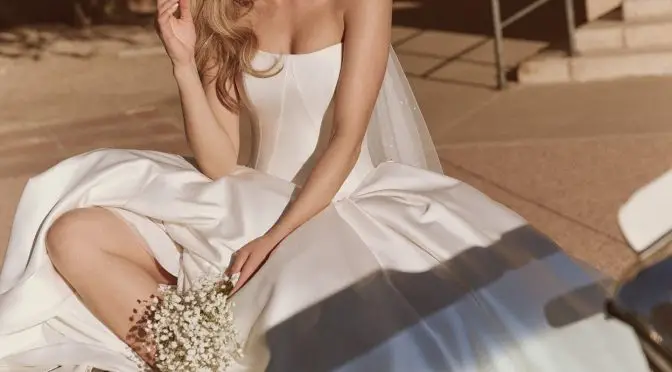 Beautiful bride wearing ballgown and sunglasses